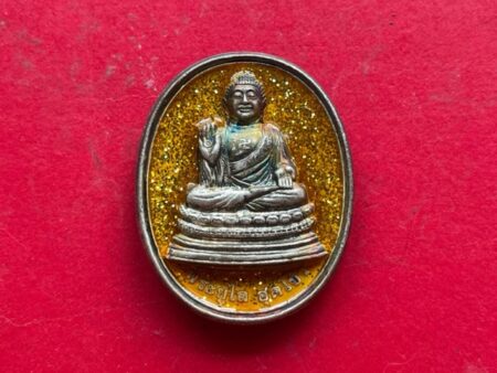 Wealth amulet B.E.2522 Phra Yulai silver coin with yellow background by Wat Don (GOD335)