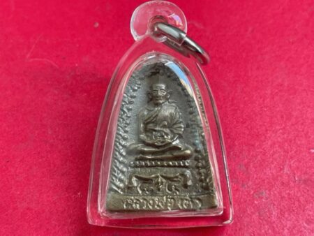 Protect amulet B.E.2534 LP Tao brass amulet in bell shape (MON951)