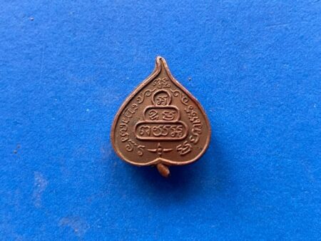 Wealth amulet B.E.2510 Nam Taow Yant copper coin in Bho leaf shape with pin by LP Jao Khun Nor (TAK202)