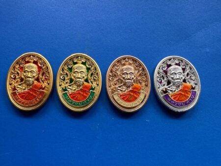 Wealth amulet B.E.2557 set of LP Khambu brass with color background 4 coins – Charoen Tham batch (MON1023)