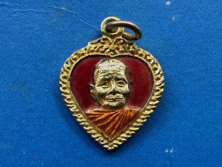 Wealth amulet B.E.2520 LP Waen copper coin in small imprint with gold color and red background (MON1201)