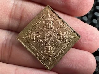 Rare amulet B.E.2519 Phra Phrom See Nah brass coin in diamond shape by LP See (GOD535)