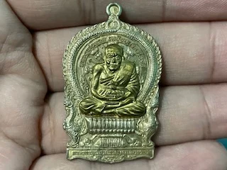 Protect amulet B.E.2540 LP Thuad copper coin with brass mask by Wat Bowornniwet (MON1148)